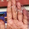 হাতে বোনা বড় পাশের ঝাকি জাল । নদীর স্রোতে মাছ ধরার জাল
